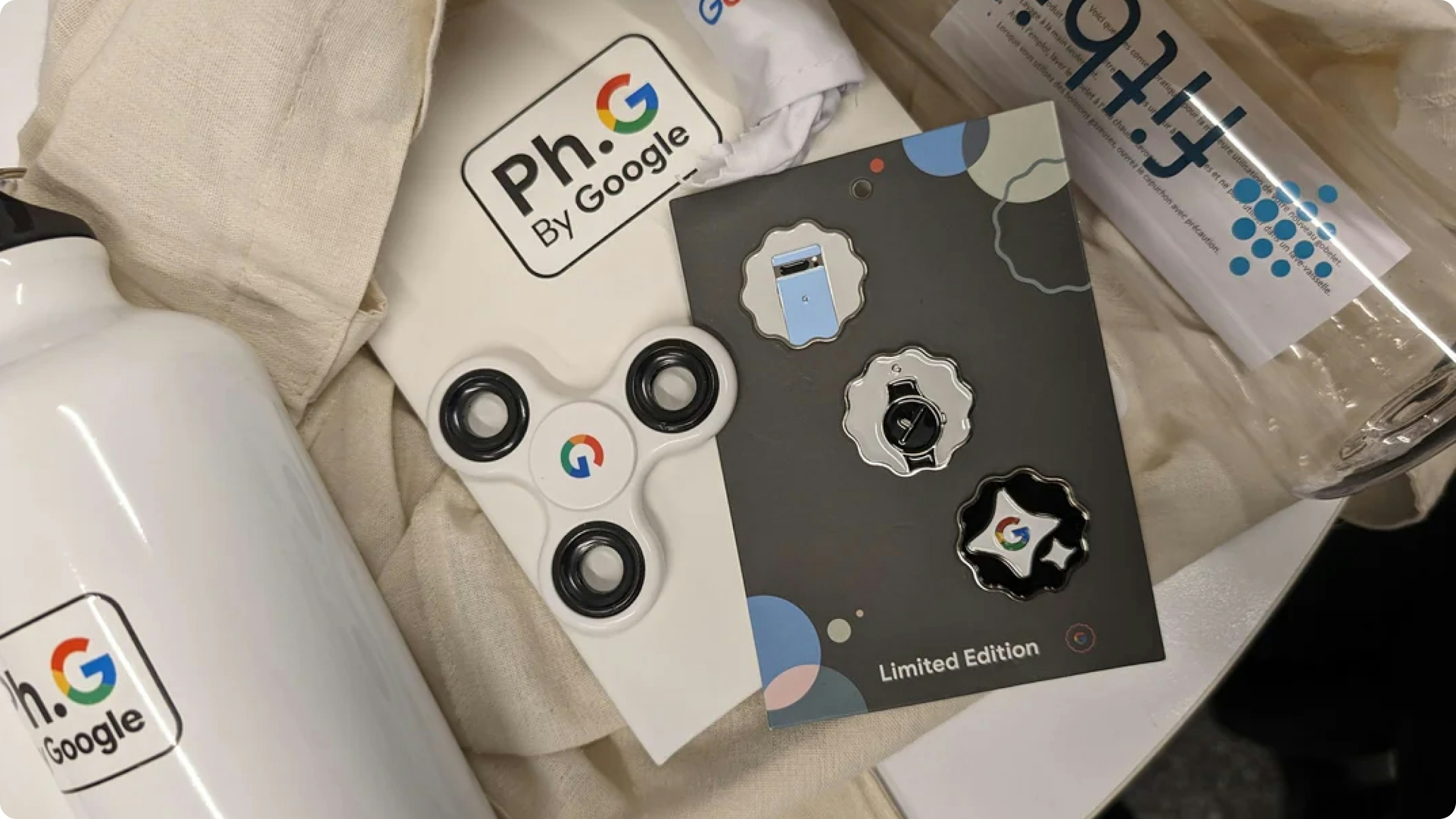 Conference swag bag with a small fidget item and branded drinkware for daily use