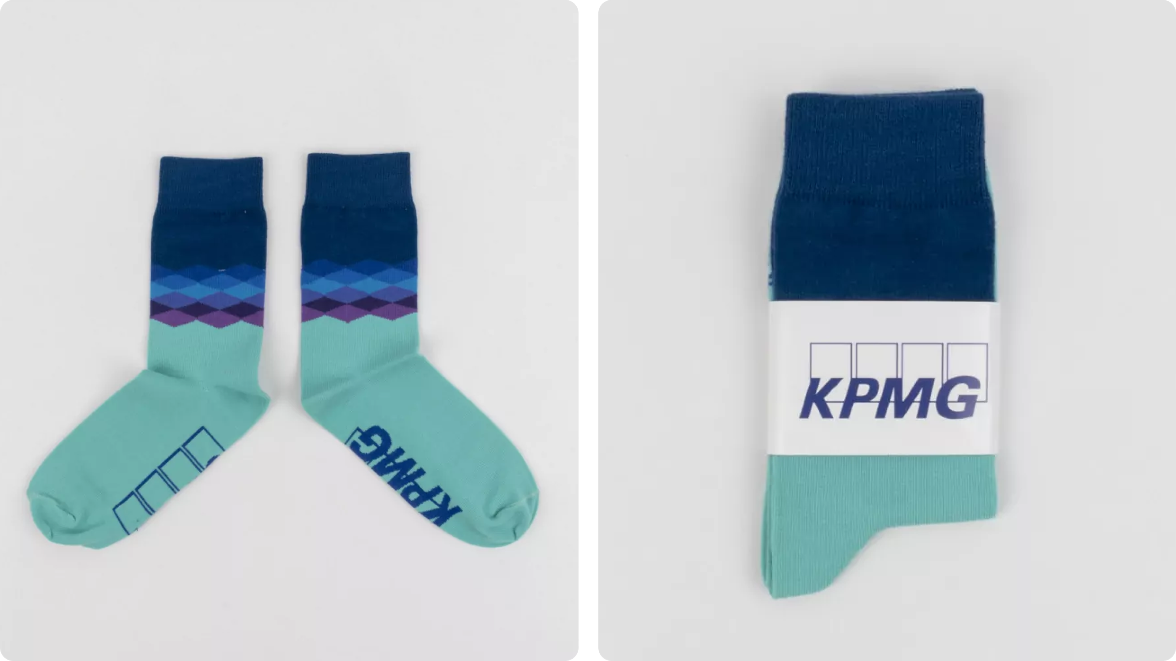 Turquoise and navy socks with geometric band and KPMG label, folded and laid flat.