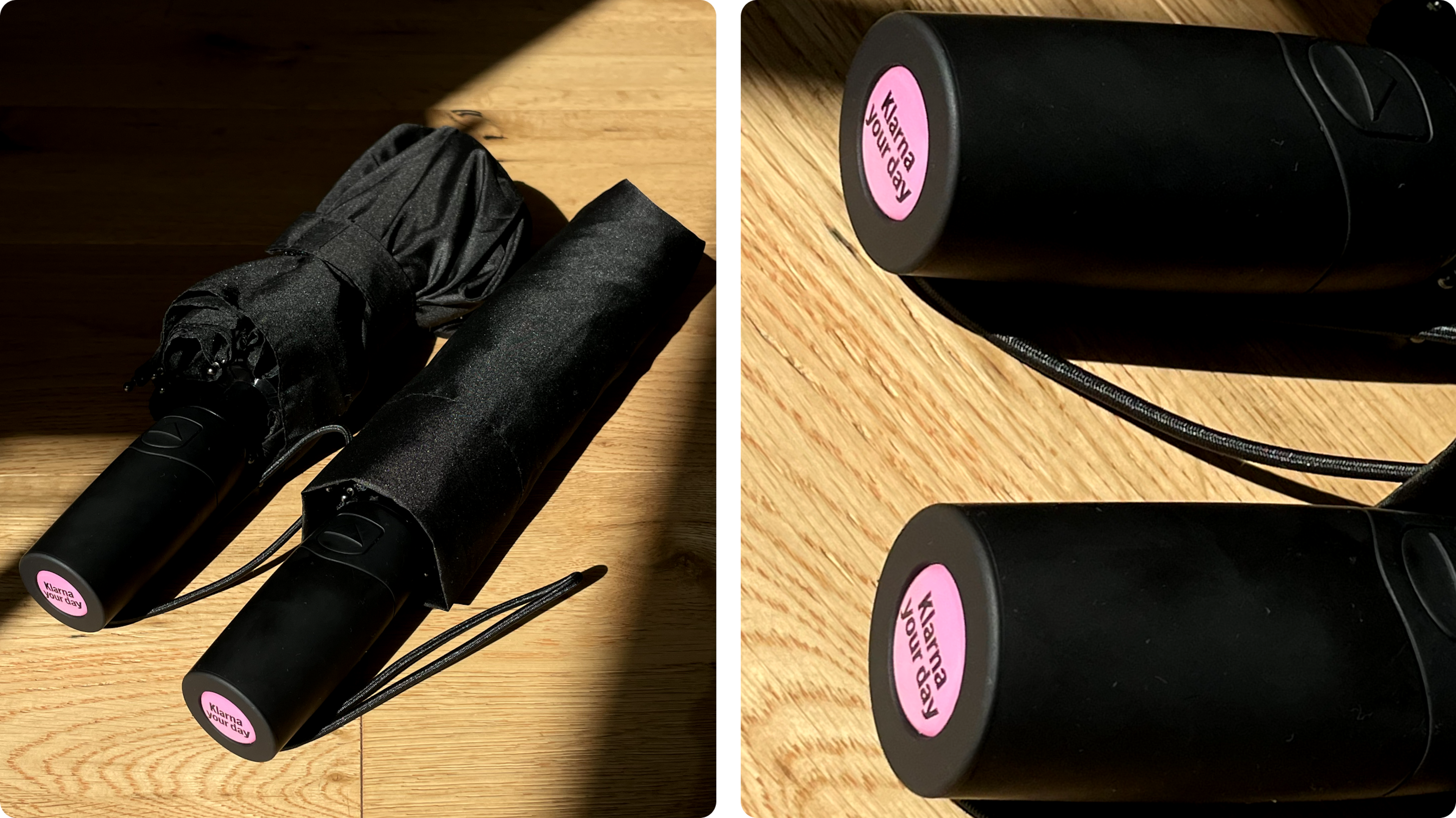 Zwei schwarze, faltbare Regenschirme auf Holzboden, Detail der Automatikgriffe