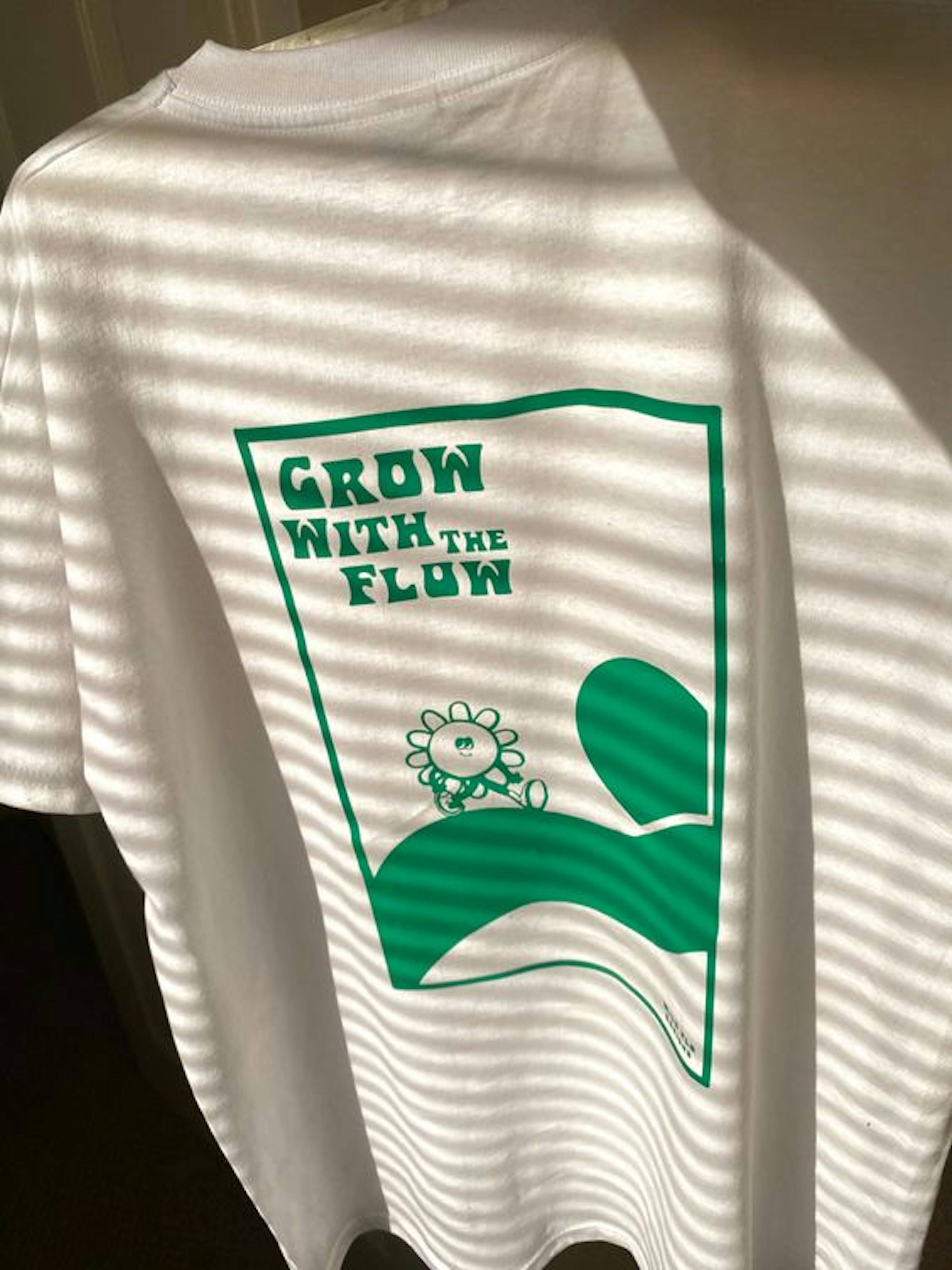 Grow with the flow tee