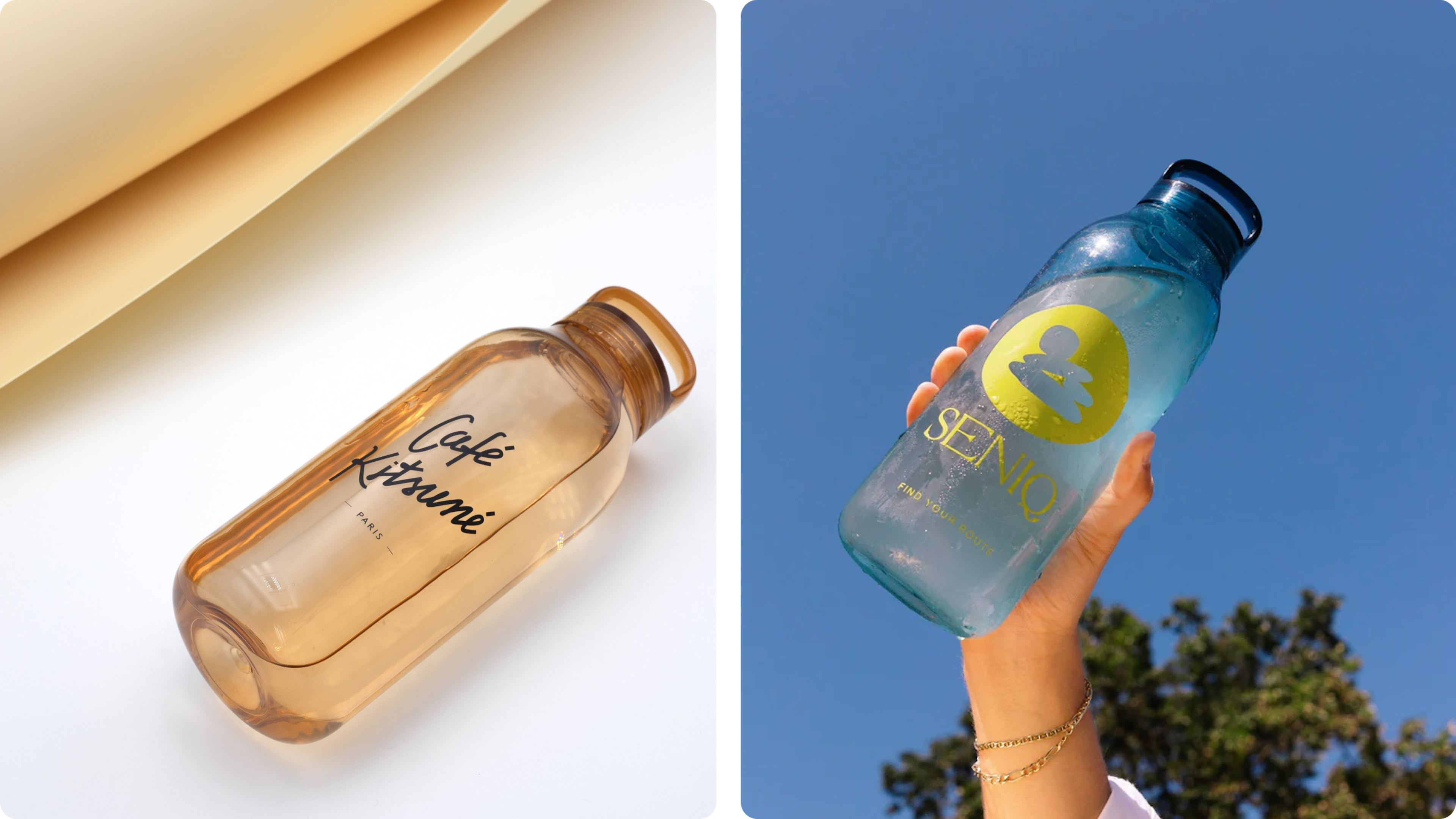 Reusable water bottles with bold logos, held up outdoors against a bright blue sky